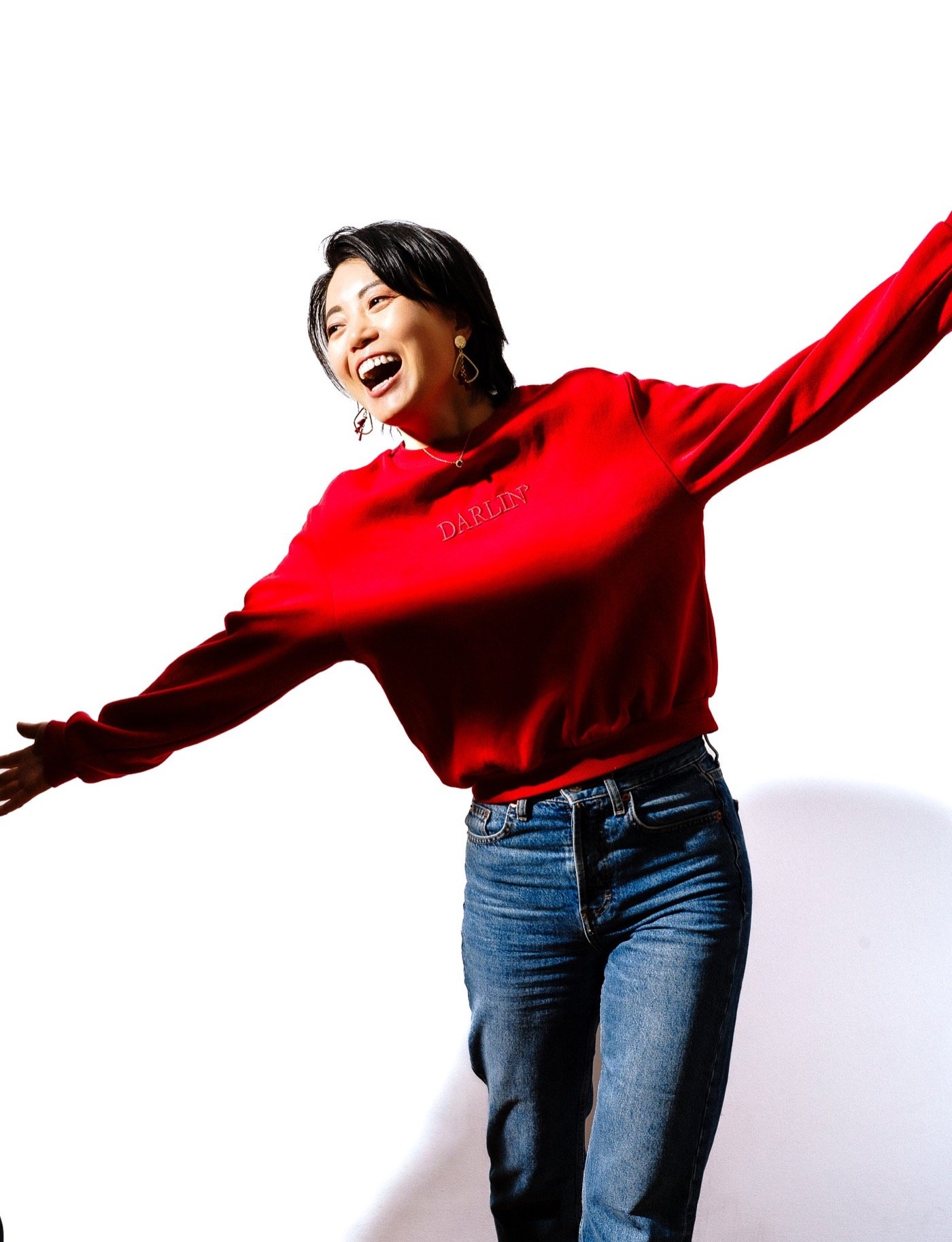 Woman in a red jumper dancing