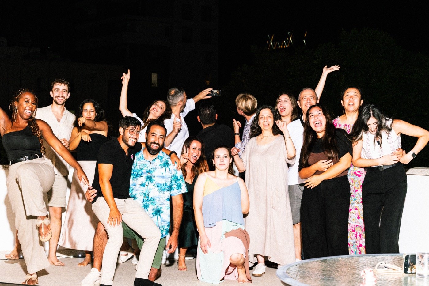 Group photo of friends at night