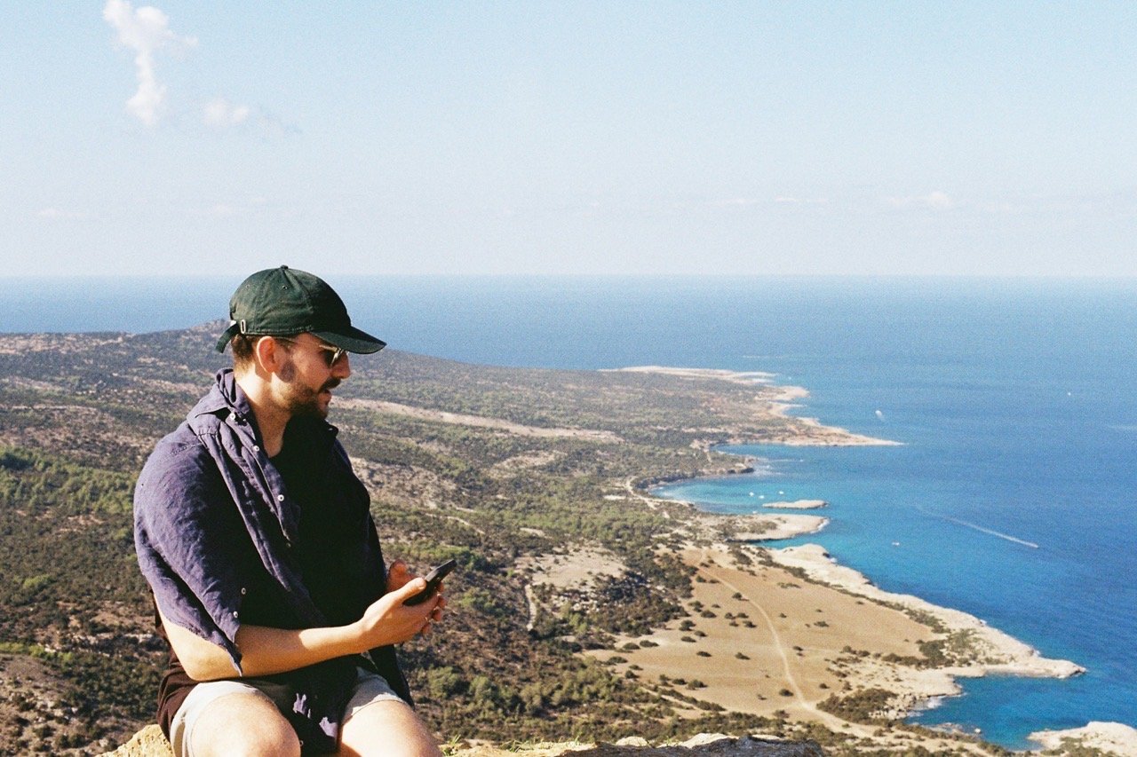Man on a clifftop above the sea