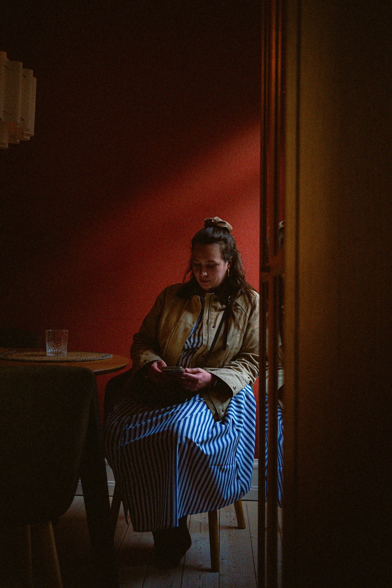 Woman in a dark red interior
