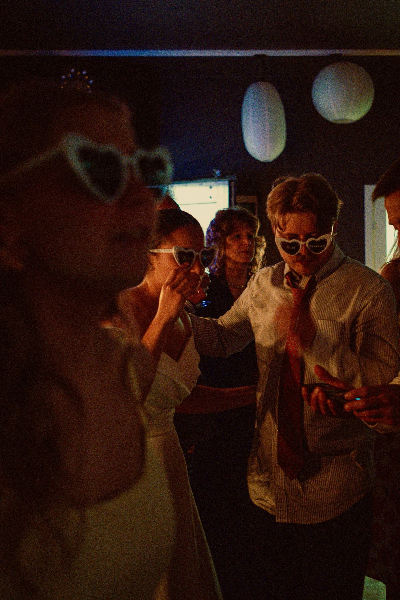 Guests dancing at a candlelit party