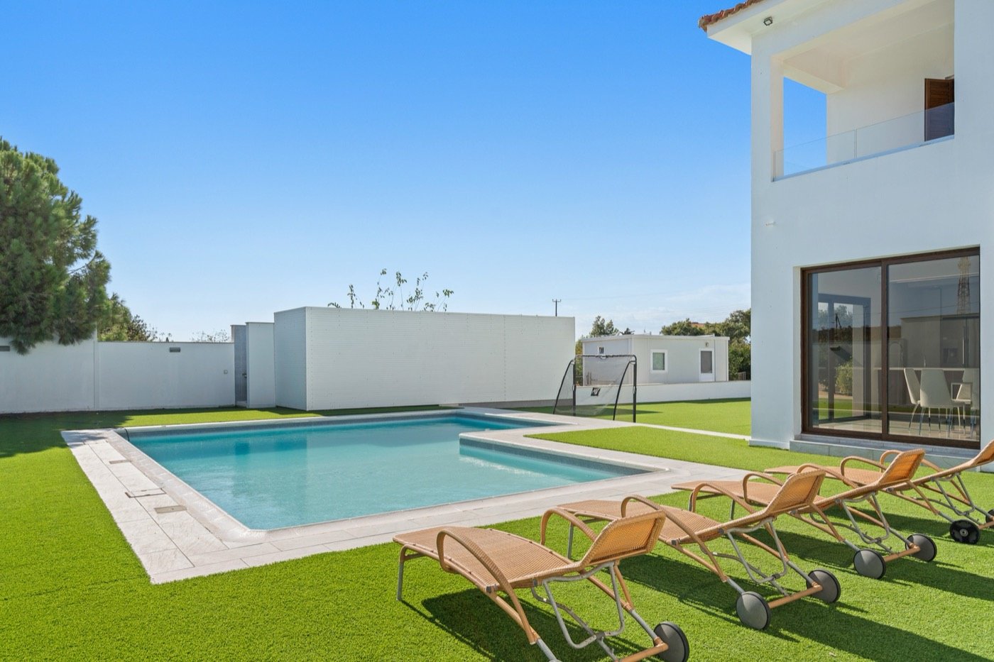 Villa with a swimming pool and lawn