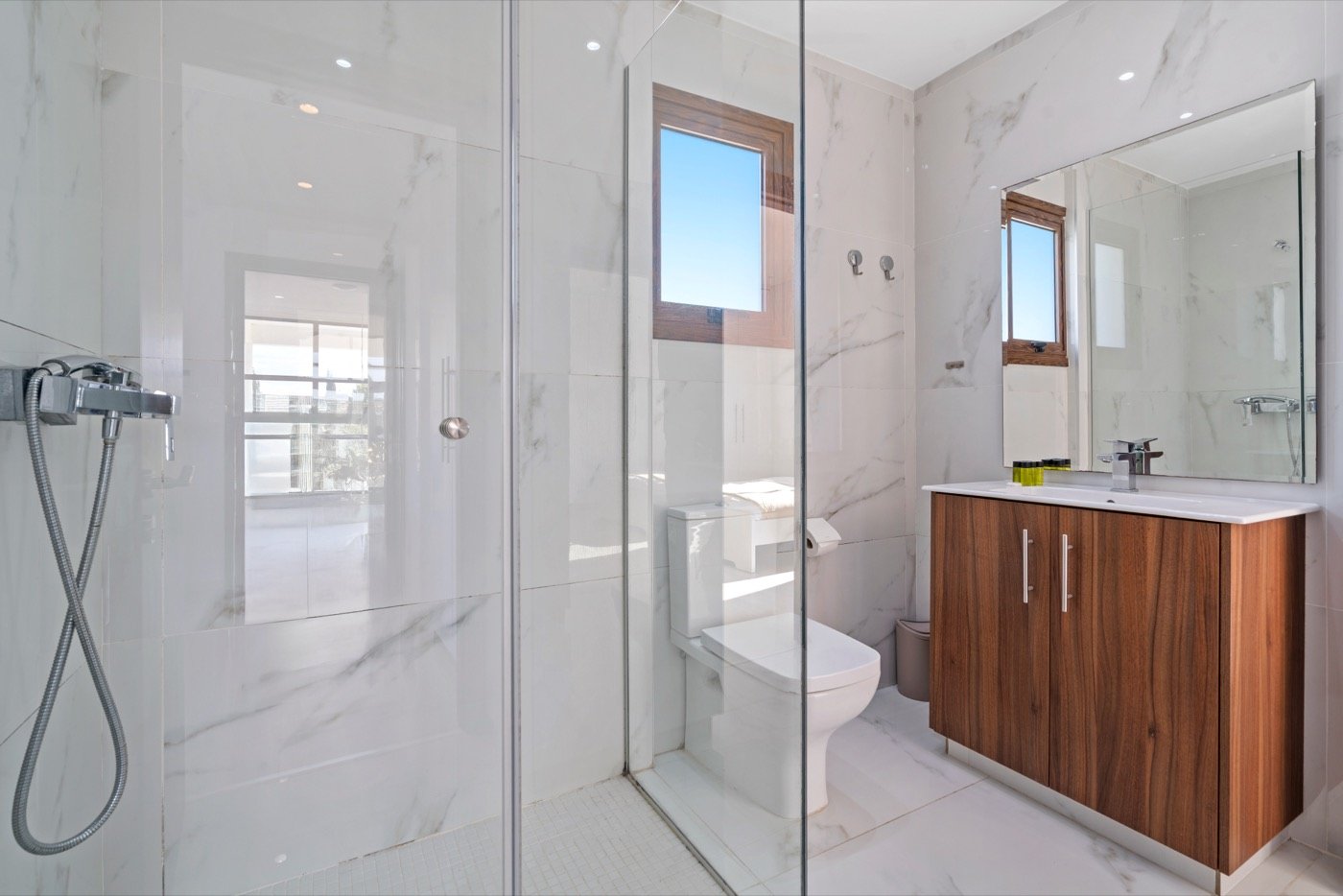Marble bathroom with a glass shower