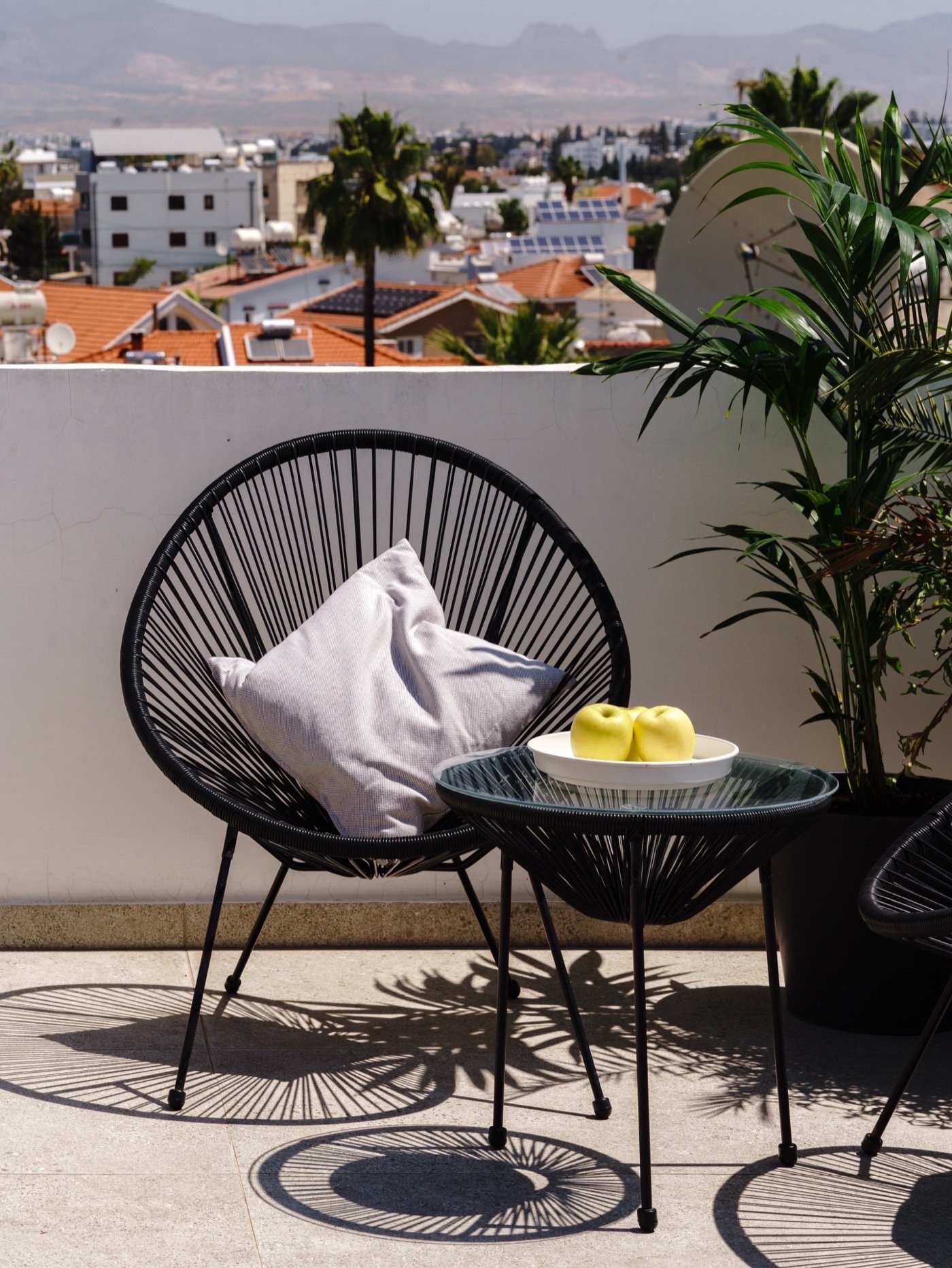 String chair and table on a sunny terrace