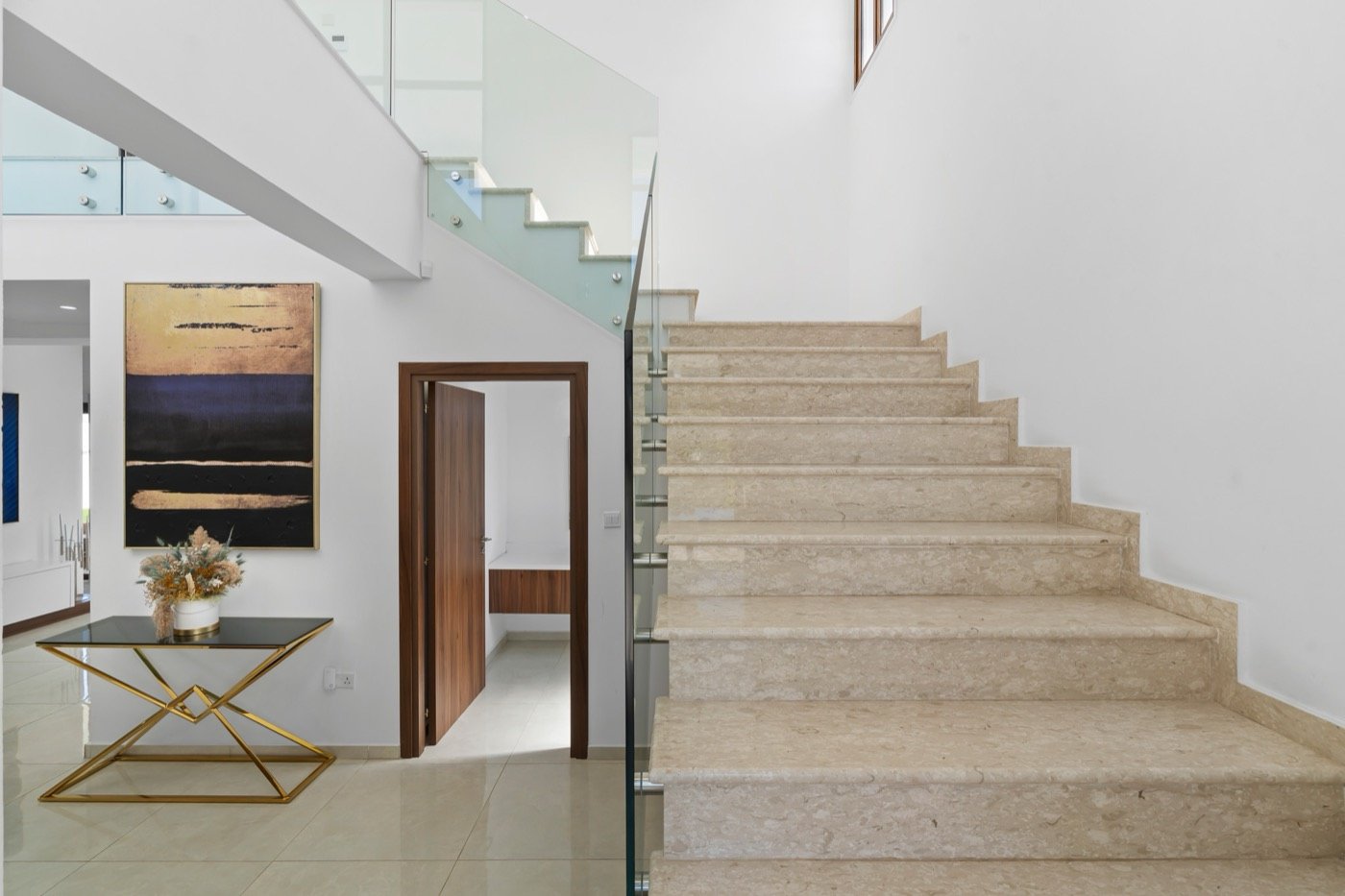 Stone staircase with a glass balustrade