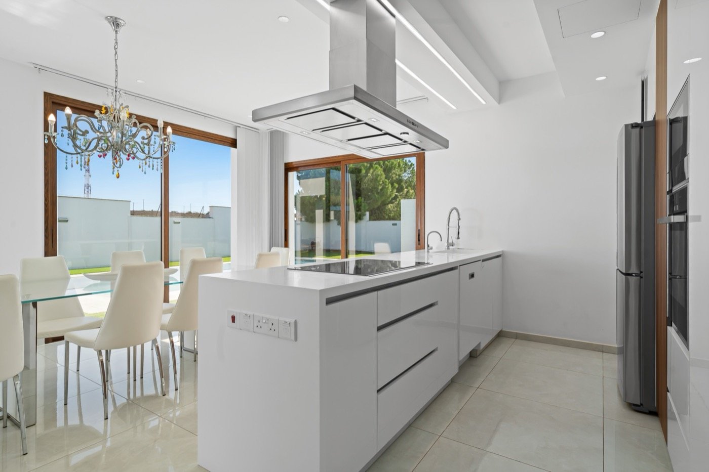 Bright white kitchen and dining area